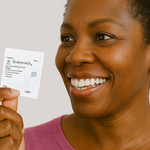 Woman holding SurvivorRx Packet