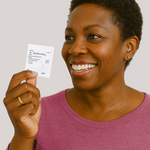 Woman holding SurvivorRx Packet